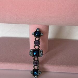 Vintage-style bar brooch or pin featuring a gunmetal-tone